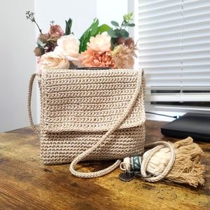 Woven crossbody bag with tassel